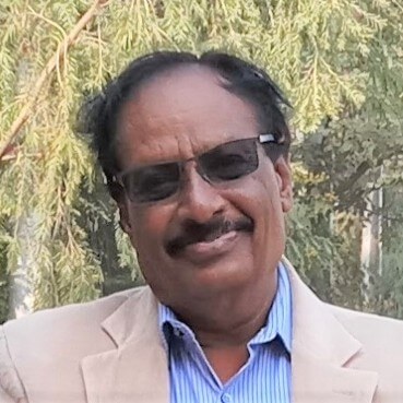 A photograph of Dr. Srinarahari, an Asian man with dark hair, looking into the camera.